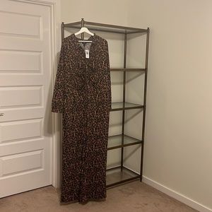 Wide leg Jumpsuit. Torrid size 3 (22-24). Black background with floral/vines.